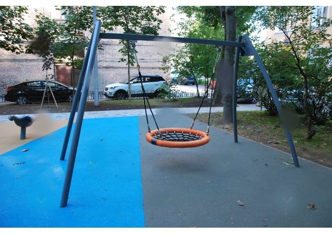 Swing for children with disabilities with a swing mechanism